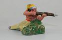 Indian Brave Crouching Behind Rock Firing Rifle